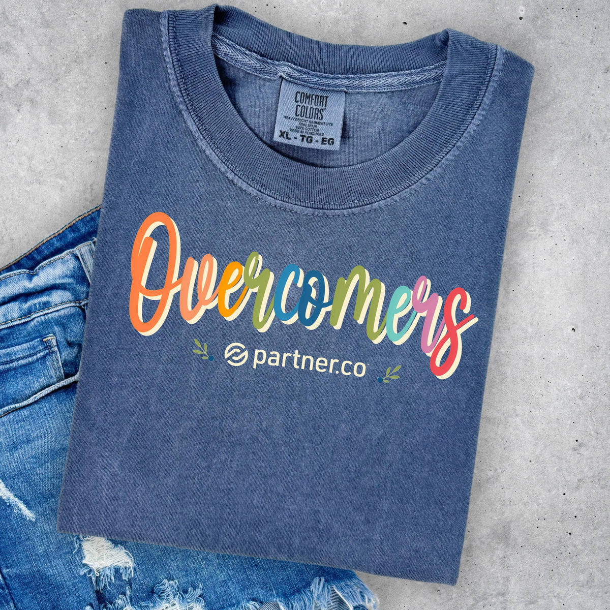 Colorful Overcomers design on Denim blue Comfort Colors T-shirt