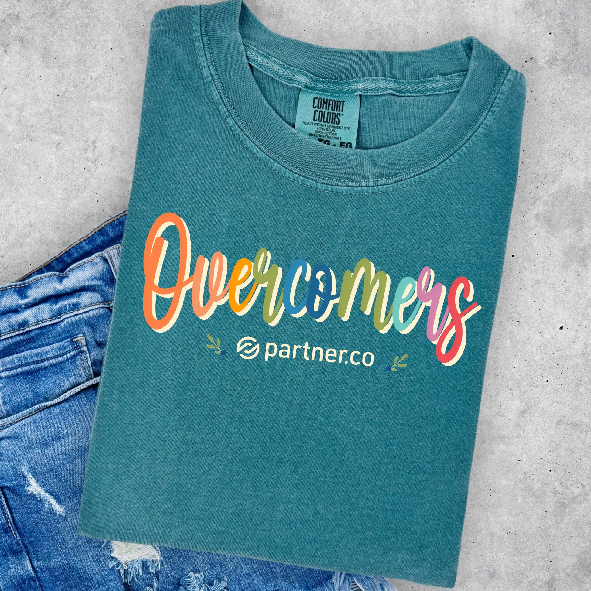 Colorful Overcomers design on Emerald green Comfort Colors T-shirt