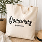 Natural canvas tote bag with black Overcomers design